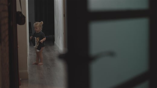 Little girl putting on oversized boots | Premium Stock Video Footage