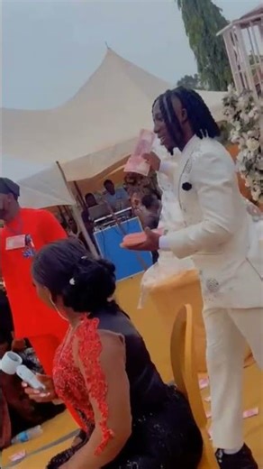 M0ney na water, the love is LOUD! #WeddingVibes #MoneyRain #NaijaWeddings #Shorts