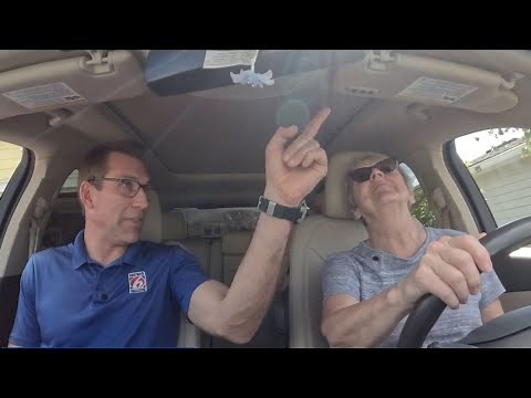 Here’s how to program your garage door opener built into your car visor