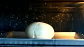 Bread baking and rising in the oven time lapse