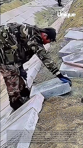 Canal construction: using a hook to place concrete slabs