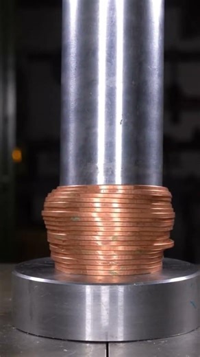 The coin was compressed with full force by the hydraulic system.