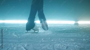 Skater's legs while doing a spinning element in slow motion