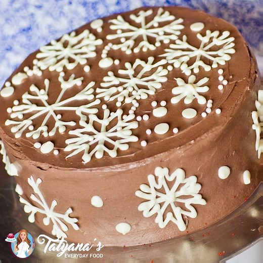 {NEW RECIPE} Enjoy your eggnog in cake form with this festive chocolate eggnog cake! Full recipe on YouTube: http://bit.ly/2h3sq9X #Christmas #holidays #eggnog #eggnogcake #cakerecipe #cakevideo #videorecipe #dessert #eggnoglatte #chocolate #frosting #snowflakes | Tatyana's Everyday Food