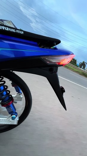 Blue Motorcycle Close-Up: Wave110i Features