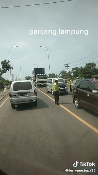 Vehicle Convoy on Road: Exploring 'Panjang Lamputung'
