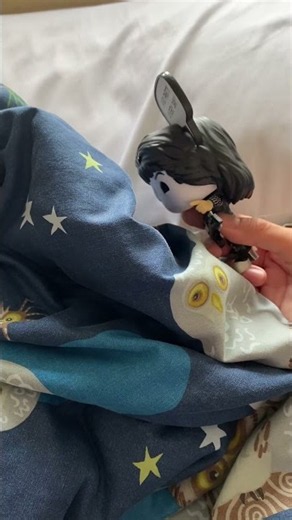 Catman hides under a blanket pretending to be cold