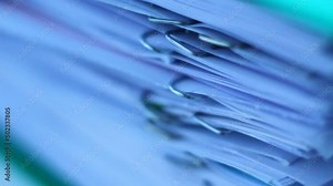 A stack of documents, papers, files. With staples. Macro clip.