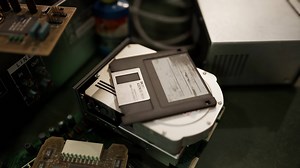 old computer floppy disk and motherboard