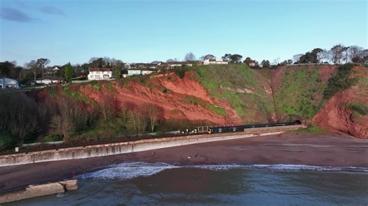 4.2K views · 47 reactions |  Resilience work on the Devon cliffs between Dawlish and Holcombe to help protect the iconic coastal railway line was successfully completed last month as part of the South West Rail Resilience Programme.  https://www.networkrailmediacentre.co.uk/news/passengers-in-the-south-west-to-benefit-from-more-reliable-railway-as-cliff-resilience-milestone-is-completed #Dawlish #Holcombe #Resilience | Network Rail | Facebook