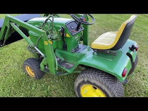 John Deere 317 with a Johnson Loader
