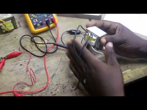 Testing 240/12V transformer with a multimeter.