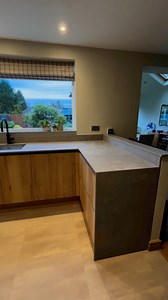 Welcome to the heart of modern living – A kitchen that blends Scandinavian minimalism with the warmth of natural elements. A reimagining of an existing space providing the most perfect ergonomic and aesthetic layout, complete with the all important pantry | Newcastle Kitchen and Bedroom Company