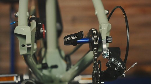 The Park Tool DH-1 Dummy Hub, or sleeping hub, slides into rear dropouts and replaces the rear wheel for chain cleaning and transport. The DH-1 is compatible with all multi-speed and 1/8” bicycle chains. The innovative design allows the bike to be shifted with the wheel removed, and works with open dropout and 12mm thru-axle frames. bit.ly/35bDyv9 | Park Tool