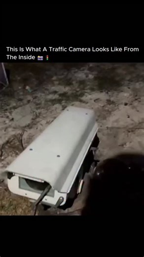 CURIOSITY on Instagram: "You think Big Brother is watching you with high-tech spy gear. It’s actually a $200 camcorder in a fancy box. 📹🕵️‍♂️ You are looking inside a standard traffic surveillance unit. While the government contracts for these systems can run into the tens of thousands of dollars per unit, the hardware inside is shockingly pedestrian. The "eye" of the law is often just a consumer-grade Canon or Sony camcorder, modified with a robotic mount for pan and tilt. The expensive-looki