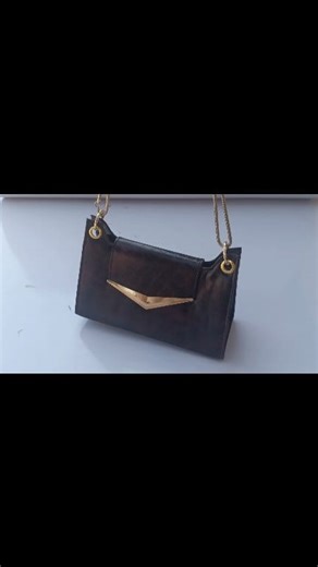 ✨ “Classy. Bold. Timeless. This chocolate brown croc-textured handbag with golden touch is made to turn heads. 🖤💛” #evergreenvocational #bagmakingclass #fblifestyle | Evergreen Vocational