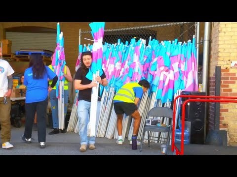 Project Rainbow volunteers distribute more than 1,800 flags ahead of Trans Day of Visibility