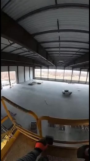 Подокном on Instagram: "POV helmet cam of a roofer on a boom lift in a warehouse training reenactment. Watch the moment a “doesn’t feel right” tie-off fails and the lift tips. Use this as a sobering reminder to stay clipped, stay alert on every job. Subscribe for more construction safety shorts and training scenarios. #constructionSafety #roofing #boomLift #fallProtection #jobsiteSafety #PPE #workplacesafety"