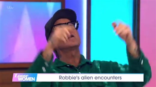 2.1K views · 24 reactions | Robbie Williams saw a #UFO in LA in 2004: “Size of two penalty boxes. Matte black. Yellow lights. Close enough to hit with a tennis ball.”  He’s not saying aliens. He’s saying: ours. | Extraterrestrials And Contactees | Facebook