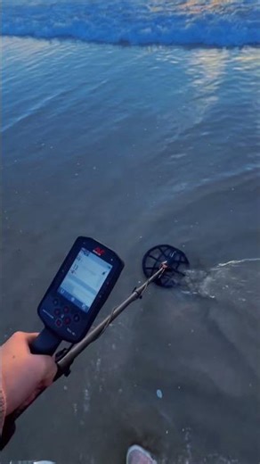 Beach metal detecting the surf