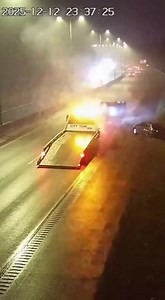 CAR HITS LOADING RAMP OF TOW TRUCK AT FULL SPEED AND LAUNCHES INTO THE AIR December 12, 2025 – Foggy Interstate, Late Evening A shocking traffic incident was caught on highway surveillance cameras when a speeding car, barely visible in thick fog, slammed into the tilted ramp of a tow truck and launched into the air like a stunt gone wrong. The footage shows the tow truck parked on the shoulder with its loading bed extended, hazard lights glowing faintly through the soup of fog. Moments later, he