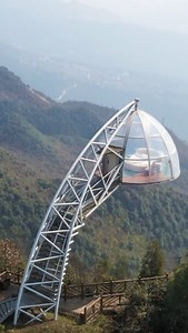 131K views · 3.8K reactions | A bubble-shaped hotel room is suspended in midair on the side of a cliff in Guizhou, southwest China. Holidaymakers can enjoy a 360-degree view of the surrounding mountains and valleys through the transparent glass "walls" of their room, perched on the end of a steel hanger. Only those with an adventurous spirit need apply. | China Plus Culture | Facebook