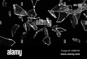 Glass shards exploding and scattering in ultra slow motion at 1000 fps. High-detail fragments suspended in air, creating dramatic cinematic impact visuals Stock Video Footage - Alamy