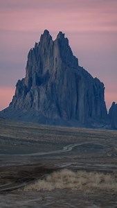 🤩 This earth is more beautiful than I can ever comprehend! Like if you agree 🙌 🚨This formation is on the Navajo Reservation in New Mexico. It is closed to the public, so the only way to see Shiprock is to admire it from the main highway, which still affords magnificent views as you see in this video. 🪨The rock towers over 1500 feet above the desert plain, the ancient throat of a volcano revealed over the course of millions of years of erosion. 🦅This location is significant for the Navajo pe