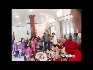 A Traditional Lao Baci Ceremony (Vilakone's Wedding)