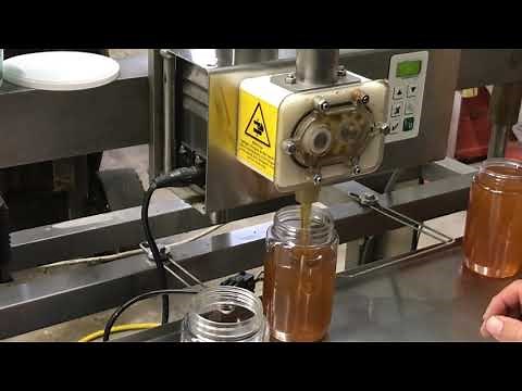 Filling honey jars the easy way.