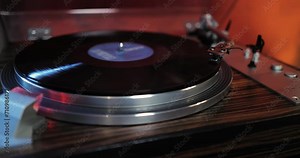 80s turntable, a vinyl rotates on the platter, vintage hi fi components