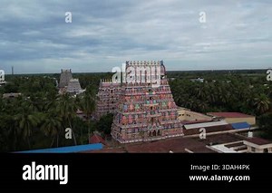 South indian temple Vaitheeswaran Koil temple and town in Tamil Nadu, India, showing historic architecture, lush green landscape, and peaceful village surroundings Stock Video Footage - Alamy