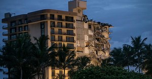 Search at Florida condo collapse site pauses amid concern about the structure that’s still standing