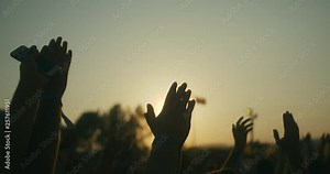 People having fun and clapping hands at the music concert in slow motion.