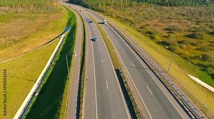 Transport at highway road. Aerial view of highway road. Bird eye view of cars traffic at road. Cars driving over highway. Aerial view of road traffic. Drone view of highway landscape