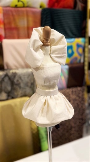 She may be tiny… but many of Max’s big design ideas starts right here. 👗 🪡 This muslin prototype is hid test run for a bubble skirt that will walk the runway in Paris Fashion Week. Small practice, big dreams. 💛 What do you hope the final runway version looks like? | Max Alexander