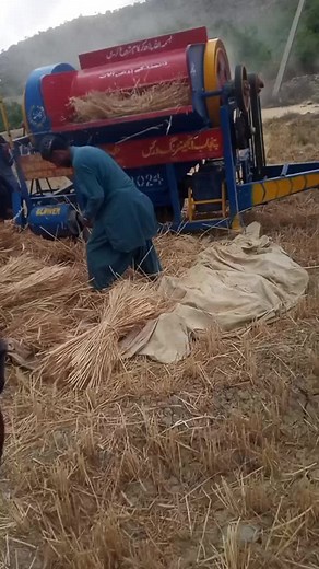 Traditional Thresher Machine in Rural Setting