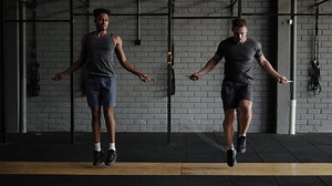 Two men jumping rope in a gym | Free Stock Video Footage