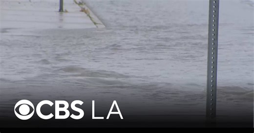 Rain flood Los Angeles County streets and create traffic nightmare for drivers