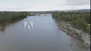 Drone aerial footage of severe flooding and shoreline damage in the Nepean River near Victoria Bridge in Penrith in New South Wales in Australia