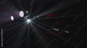 Disco Ball with Reflected Moving Rays Rotating. Mirror disco ball in white light. Close-up. Mirror ball spinning indoors. Performance. The reflection of lights.