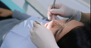 Woman doing check up in dental office