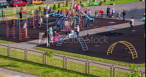 time lapse with a view of the playground with a lot of parents with children