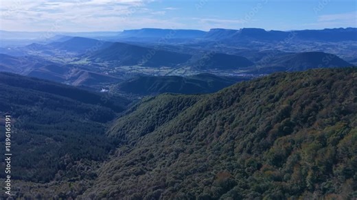 Aerial view from a drone of Mount Coliza (897 m) (Kolitza in Basque) with the chapel of San Sebastián and San Roque in the Ordunte Mountains in Valmaseda. Bizkaia, Basque Country, Spain.