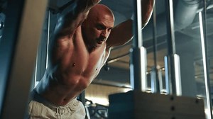 clip-3444546981-muscular-bodybuilder-bare-torso-engages-rigorous-workout