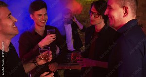 Bachelor's Party at a Nightclub/Guys are talking and drinking whisky at a nightclub. One of them is going to marry soon