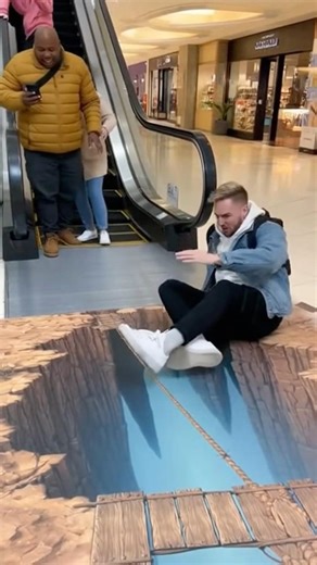3d illusion makes him fall over # funny