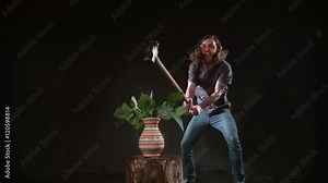 Man smashing ceramic vase with hammer in slow motion, shot on Phantom Flex 4K at 1000 fps