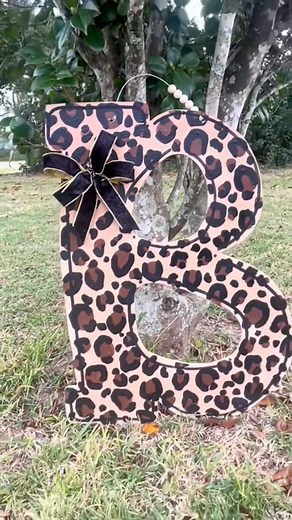 BOW TUTORIAL DIY BOWS #bow #bows #bowtutorial #christmasbow #holidaybow #leopardprint #doorhanger #holidaycrafts #DIY #diybow #easybow #simplerecipe #sidehustle | Front Porch Sittin’