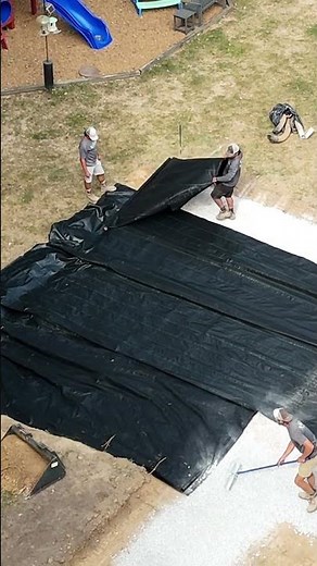 Digging out, adding rock, and compacting to create a solid base for this new paver patio.